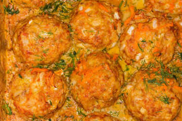 Rice meatballs stewed with red gravy, top view close-up
