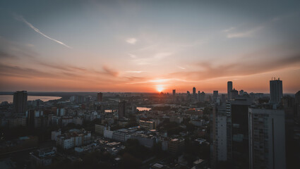 City Skyline Silhouette Against Vibrant Sunset Sky

