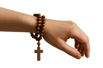 Rosary with cross wrapped around wrist of hand on transparent background