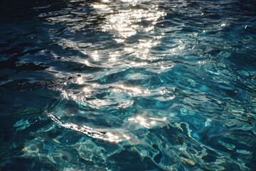 Reflection of sunlight on blue water surface