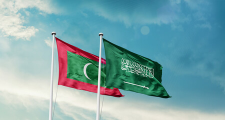 Maldives and Saudi Arabia friendship flags are waving in the sky. Two country flag for agreement or deal. Maldives KSA national flag for commitment.