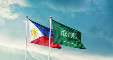 Philippines and Saudi Arabia friendship flags are waving in the sky. Two country flag for agreement or deal. Philippines KSA national flag for commitment.