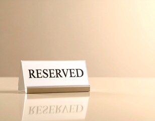 Table tent with the word reserved on a shiny surface