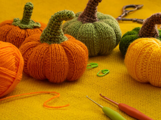 Handmade autumn crochet decor, pumpkins, leaves knitting tools. 