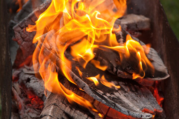 Fire in the grill. Fire in the fireplace. Fire and coals. design