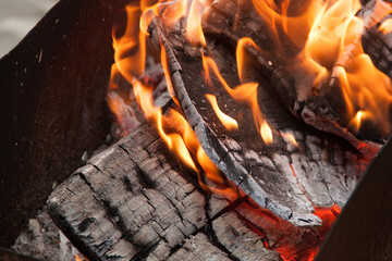 Fire in the grill. Fire in the fireplace. Fire and coals. design