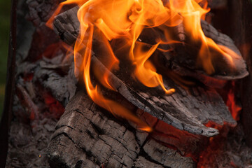 Fire in the grill. Fire in the fireplace. Fire and coals. design