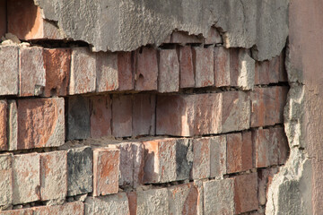Photo of an old wall. Old wall cracked plaster. Old destroyed wall. Background of old plaster