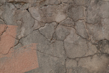 Photo of an old wall. Old wall cracked plaster. Old destroyed wall. Background of old plaster