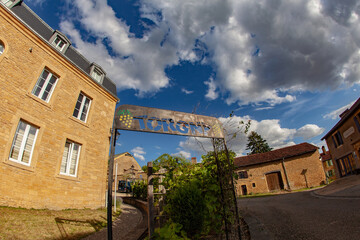 Fototapeta premium Charming village entrance: rustic sign reading 