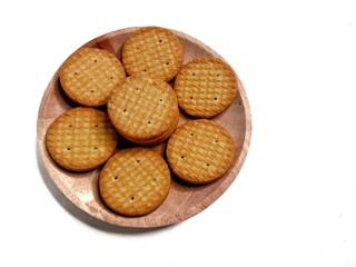Round crunchy biscuits arranged on a plate, perfect for snack, breakfast, or tea time. Tasty cookies with golden brown texture, ideal for food, bakery, and dessert concepts.