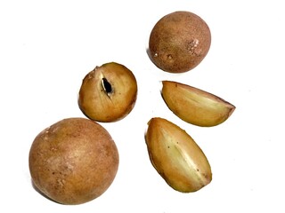 Close-up of ripe Sapodilla Fruit (Manilkara Zapota) with seed visible, isolated on white background. Ideal for tropical fruit, organic food, and healthy eating concept images.