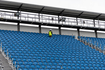 blue empty seats in a stadium