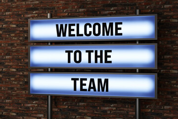 Obraz premium Welcome to the team. Illuminated sign in front of a red brick wall. Team spirit, aboard, together, invitation, team work. 3D illustration