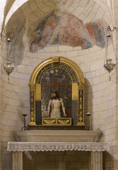 Altar of the Crucifix in the right apse of San Lorenzo Church, Verona, Italy, featuring a painted...