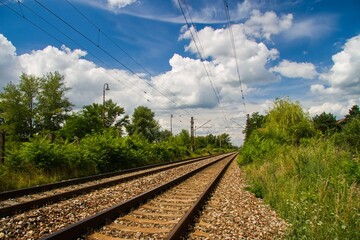 Steel rails passing through a rural area
