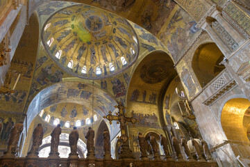 Interior of St Mark's Basilica, Venice, Italy, featuring the iconostasis with apostles' statues and...