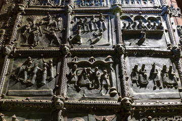 Detail of bronze door panel with biblical scenes inside San Zeno Maggiore, Verona, Italy.