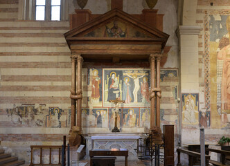 Romanesque altar with 13th-century twisted columns and frescoes by the Masters of San Zeno,...