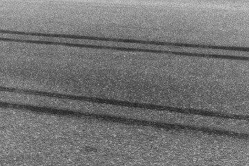 Black tire marks on road, Black rubber tire marks and tread marks, Tire trace track wheels texture...