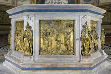 Detail of the Baptism of Christ by Lorenzo Ghiberti on the baptismal font in the Baptistery of...