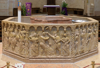 Octagonal baptismal font by Brioloto de Balneo, late 12th century, in San Giovanni in Fonte...