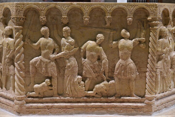 Relief of the Baptism of Christ on the 12th-century octagonal font by Brioloto de Balneo, San...