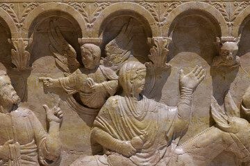 Relief of the Baptism of Christ on the 12th-century octagonal font by Brioloto de Balneo, San...