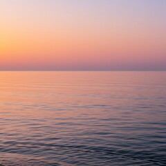 Obraz premium Peaceful Ocean Sunset with Pink and Orange Hues
