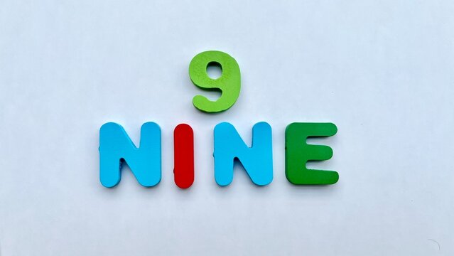 Colorful wooden number nine and its word