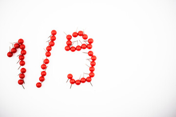 Red push pins form the shape of 