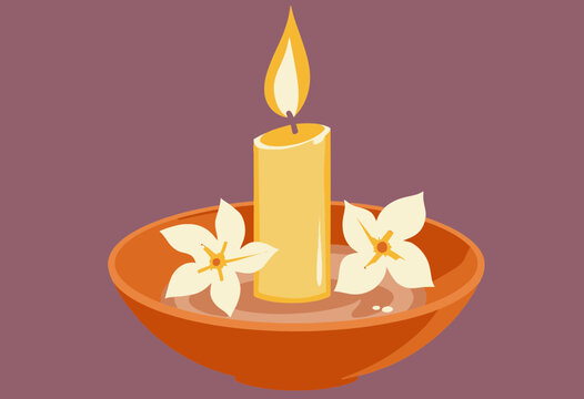 Candle with flowers on decorative bowl in warm tones  