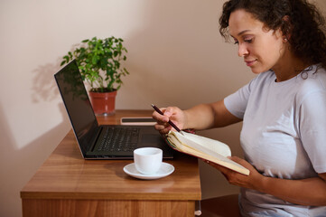 Woman Working Remotely in a Cozy Home Office Setting