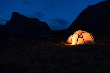 Iluminated tent in Norway at night