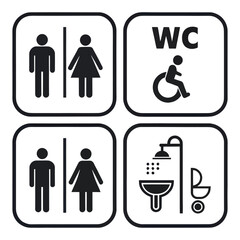 Four black and white restroom signs for men women disabled and shower