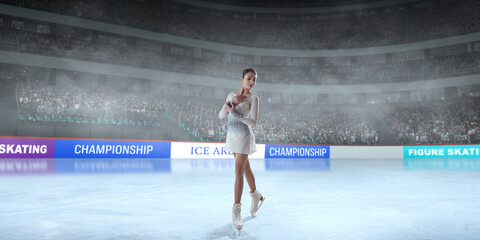 Figure skater girl skating on ice stadium.