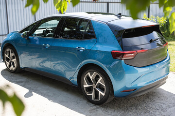 Modern electric hatchback car. Exterior details. Exterior of electric ev car. Rear view car parked....