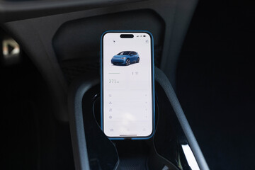 Car status information on the mobile app. Smart phone with application for electric vehicles....