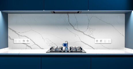 Modern kitchen. Marble backsplash. Blue kitchen cabinets.