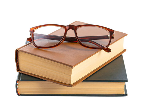 Literary Still Life: A close-up captures the essence of learning with an inviting composition of stacked books and spectacles, conveying knowledge, contemplation, and insight.