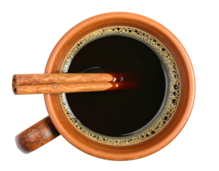 Aromatic Cinnamon Infusion: An overhead shot of a rustic ceramic mug brimming with dark, steaming coffee, elegantly adorned with a cinnamon stick. A visual delight that invites warmth and comfort.