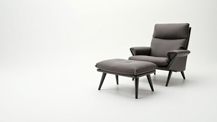 Grey upholstered armchair and footstool on white background.