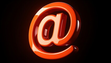 Obraz premium Closeup of a glossy orange at symbol on a black background