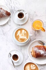 Coffee and pastries on a marble background