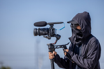 Videographer with gimball video dslr, Professional video, Videographer in event, motorized gimbal, videographer using dslr camera anti shake tool for stabilizer record video scene.