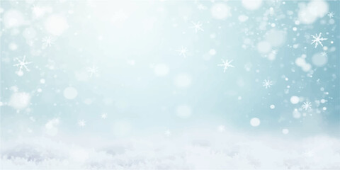 An abstract blue winter holiday background with shimmering snowflakes and light bokeh