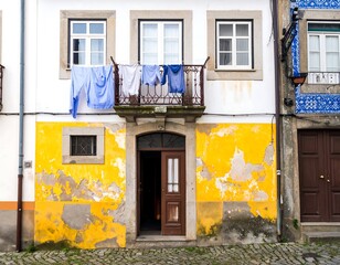 Aged European building facade with laundry