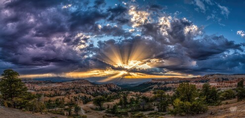 Dramatic sunset through stormy clouds over a desert landscape