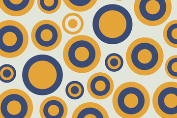 A pattern of yellow and blue concentric circles of varying sizes on a white background creating a design