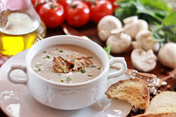 Creamy mushroom soup in ceramic bowl
